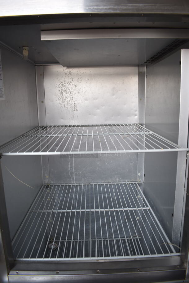 2016 Traulsen G12000 Stainless Steel Commercial 2 Half Size Door Reach In Cooler w/ Poly Coated Racks on Commercial Casters. 115 Volts, 1 Phase. Tested and Powers On But Does Not Get Cold
 - Image 3 of 5