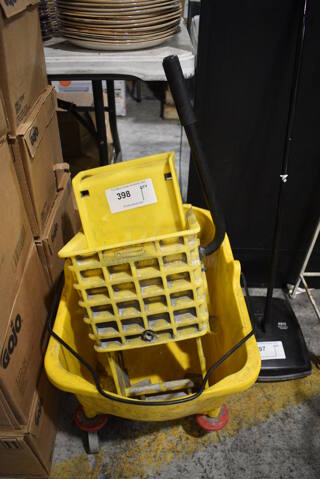 Rubbermaid Yellow Poly Mop Bucket w/ Wringing Attachment on Commercial Casters. 15x19x30