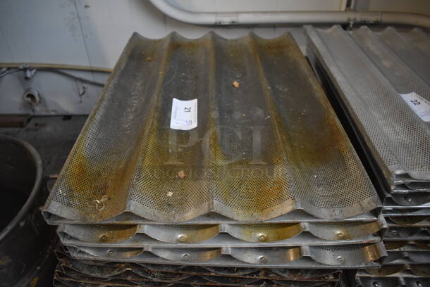 17 Metal Perforated 4 Loaf Baking Pans. 18x26x1. 17 Times Your Bid!