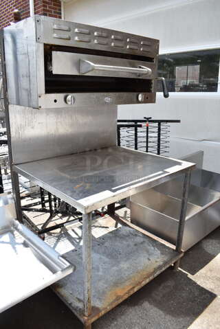 DCS Stainless Steel Commercial Natural Gas Powered Cheese Melter on Table w/ Under Shelf. 