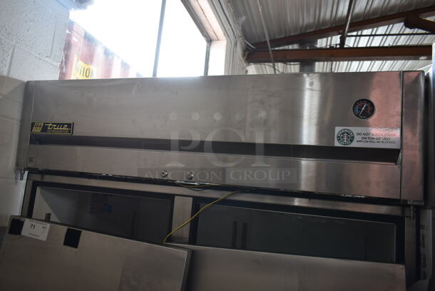 2014 True TG2R-2S ENERGY STAR Stainless Steel Commercial 2 Door Reach In Cooler w/ Poly Coated Racks on Commercial Casters. Doors Need To Be Reattached. 115 Volts, 1 Phase. Tested and Powers On But Does Not Get Cold - Image 2 of 8