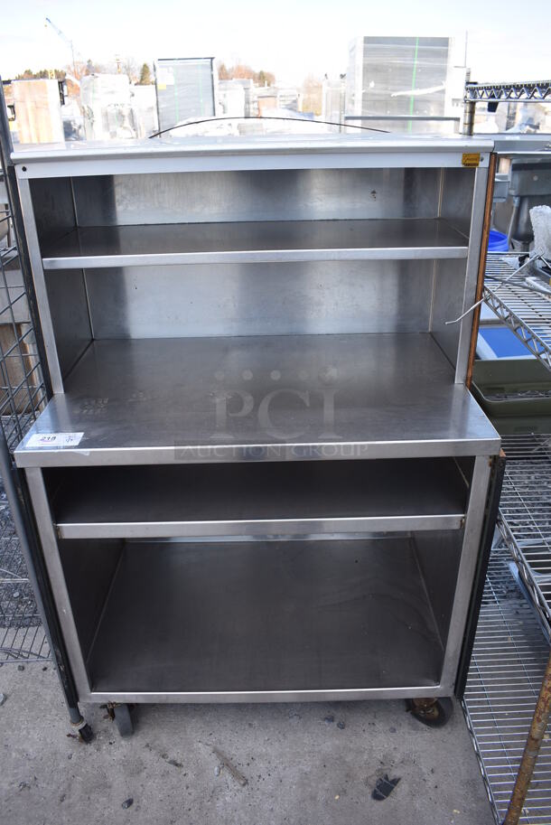 Stainless Steel Commercial Table w/ 2 Under Shelves and 2 Over Shelves on Commercial Casters. 36x24x55