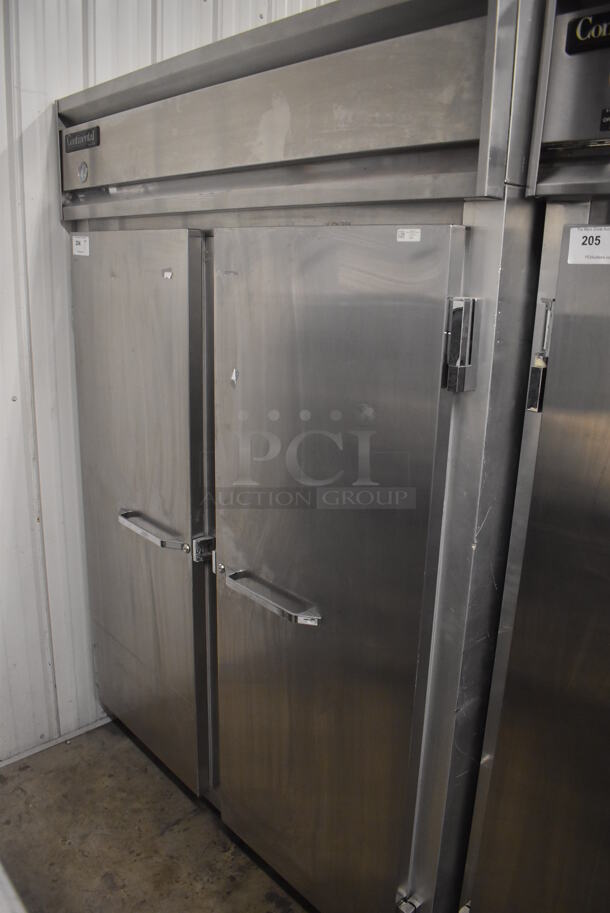 Continental 2FE Stainless Steel Commercial 2 Door Reach In Freezer on Commercial Casters. 115 Volts, 1 Phase. 57x34x82. Tested and Working!