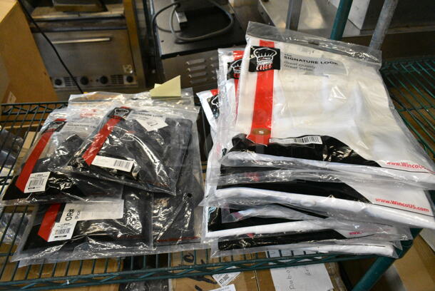 14 BRAND NEW! Items Including Winco WA-3129BK Bistro Apron and Winco WA-1221 Waist Apron, Winco UNF-6WL Chef Jacket. 14 Times Your Bid!  - Image 1 of 12