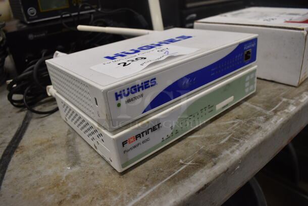 2 Items; Hughes HR4700W and Fortinet FortiWiFi 60C. 8.5x7.5x1.5. 2 Times Your Bid! - Image 3 of 4