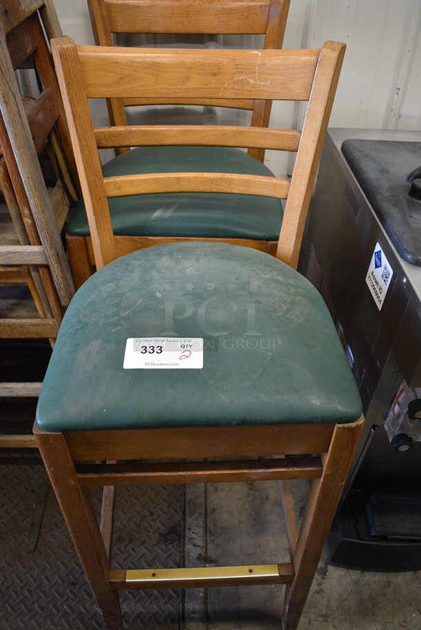 2 Wooden Bar Height Chairs w/ Green Cushion. 17x17x34. 2 Times Your Bid!
