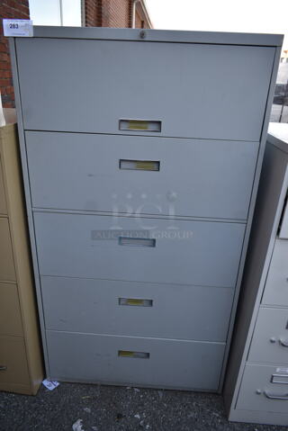 Gray Metal 4 Drawer Filing Cabinet w/ Top Compartment.