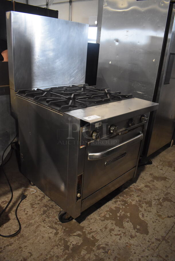 Southbend Commercial Stainless Steel Natural Gas Powered Oven With 4 Gas Burners and Stainless Steel Racks on Commercial Caster.  - Image 2 of 8