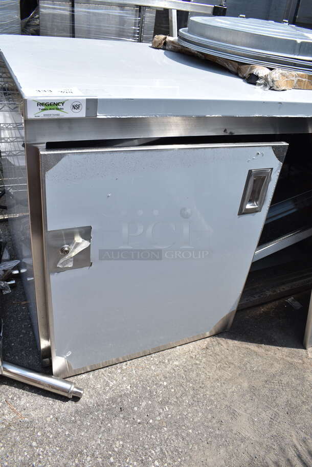 BRAND NEW SCRATCH AND DENT! Regency 600EBT3048D 30" x 48" 16 Gauge Type 304 Stainless Steel Enclosed Base Table with Sliding Doors and Adjustable Midshelf - Image 5 of 7