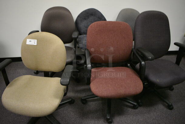 6 office chairs in a variety of colors. 6 Times Your Bid!  (Main Building)