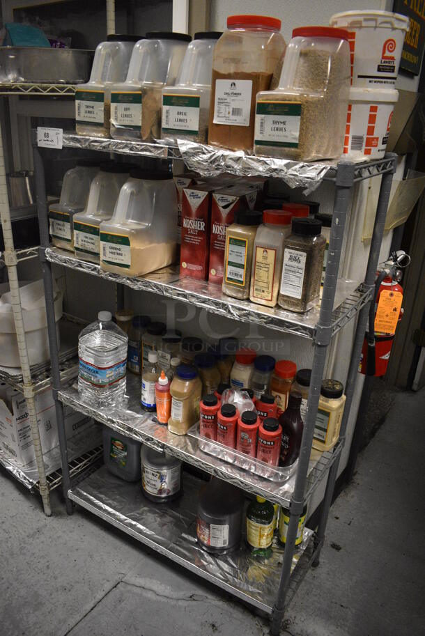 Gray Finish 4 Tier Wire Shelving Unit w/ Contents Including Seasonings. BUYER MUST REMOVE. BUYER MUST DISMANTLE. PCI CANNOT DISMANTLE FOR SHIPPING. PLEASE CONSIDER FREIGHT CHARGES. 36x14x54.5. (kitchen) - Image 1 of 9
