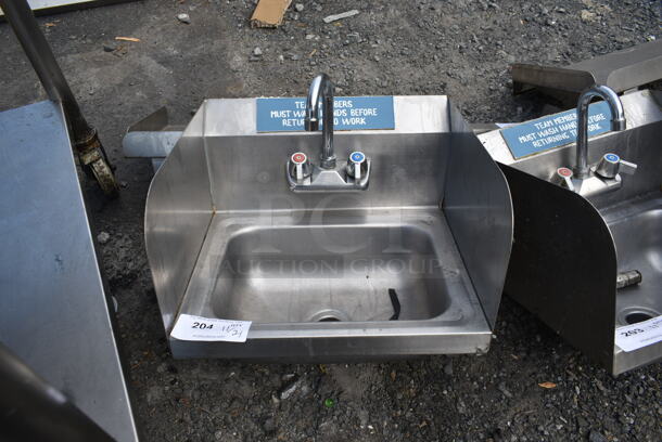 Stainless Steel Single Bay Wall Mount Sink w/ Faucet, Handles and Side Splash Guards.