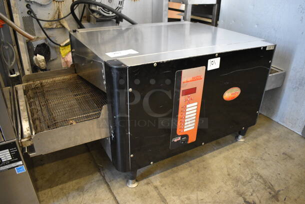 APW Wyott FLEXWAV Stainless Steel Commercial Countertop Electric Powered Conveyor Pizza Oven. 208 Volts, 1 Phase. 52x25.5x21