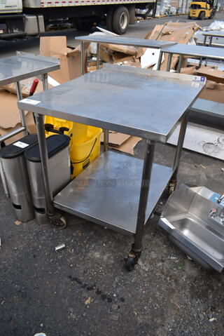 Stainless Steel Table w/ Under Shelf on Commercial Casters.
