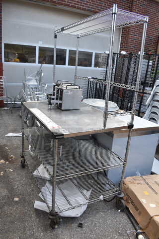 Stainless Steel Table w/ Wire Over Shelf and 2 Wire Under Shelves on Commercial Casters. Does Not Come w/ Contents. BUYER MUST DISMANTLE. PCI CANNOT DISMANTLE FOR SHIPPING. PLEASE CONSIDER FREIGHT CHARGES.