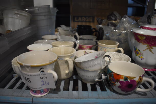 21 Various White Ceramic Mugs. Includes 5x3.5x2.5. 21 Times Your Bid!