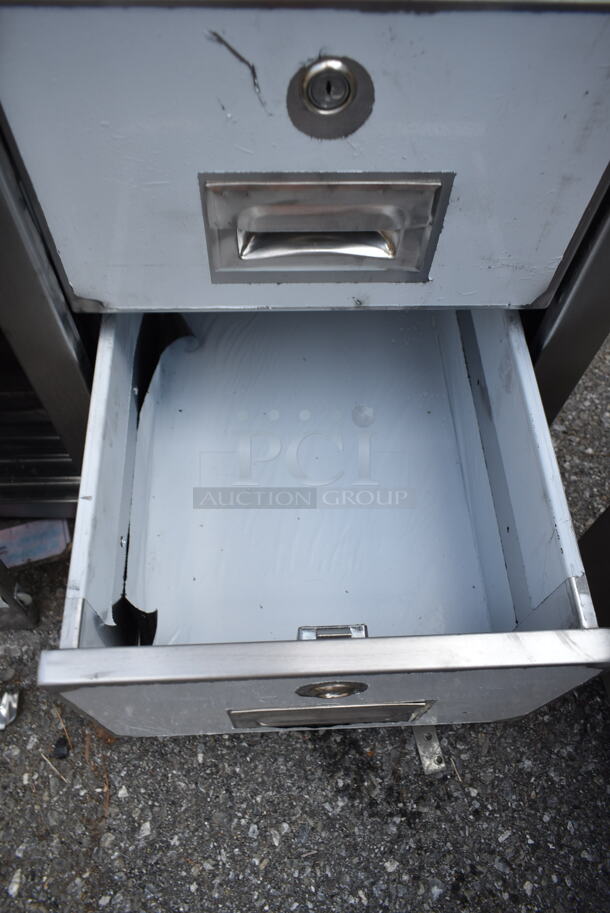 BRAND NEW SCRATCH AND DENT! Regency 600EBT2472R 24" x 72" 16 Gauge Type 304 Stainless Steel Enclosed Base Sliding Door Table with Drawers - Image 5 of 7