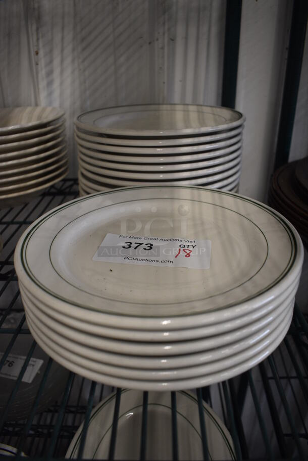 18 White Ceramic Plates w/ Green Lines on Rim. 9.5x9.5x1. 18 Times Your Bid!