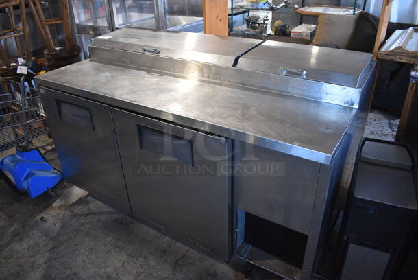 True Model TPP-67 Stainless Steel Commercial Pizza Prep Table on Commercial Casters. 115 Volts, 1 Phase. 67.5x32.5x43. Tested and Does Not Power On