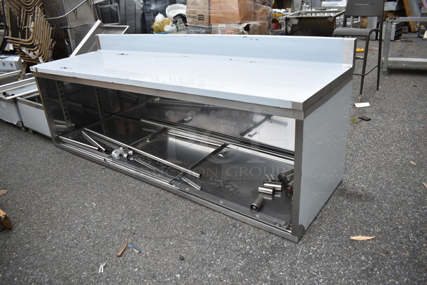 BRAND NEW SCRATCH AND DENT! Regency 600EBTB3096D 30" x 96" 16 Gauge Type 304 Stainless Steel Enclosed Base Sliding Door Table with Adjustable Midshelf and 6" Backsplash - Image 3 of 8
