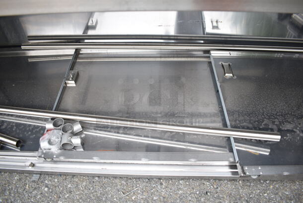 BRAND NEW SCRATCH AND DENT! Regency 600EBTB3096D 30" x 96" 16 Gauge Type 304 Stainless Steel Enclosed Base Sliding Door Table with Adjustable Midshelf and 6" Backsplash - Image 6 of 8