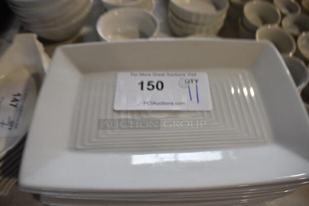 11 White Ceramic Plates. 10.5x7x1. 11 Times Your Bid!