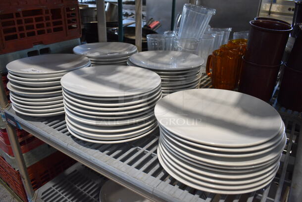ALL ONE MONEY! Tier Lot of Approximately 58 White Ceramic Plates. 12x12x1