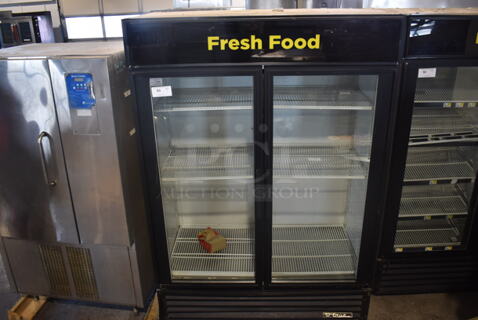True GDM-49 Two Section Reach-In Floor Standing Glass Door Merchandiser Cooler In Black With Polycoated Racks. 115V, 1 Phase. Tested And Working