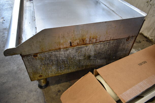 APW Wyott Stainless Steel Commercial Countertop Natural Gas Powered Flat Top Griddle.  - Image 6 of 7