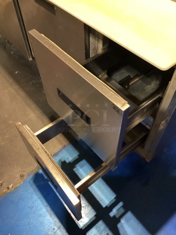 Randell Stainless Steel Dual-Sided Refridgerated Work Island, Multi-Pan Prep Table W/Two -Door and Two Drawers  Refrigerated Storage. Tested And Working. 84 x  46/52 x 58.
 - Image 8 of 11