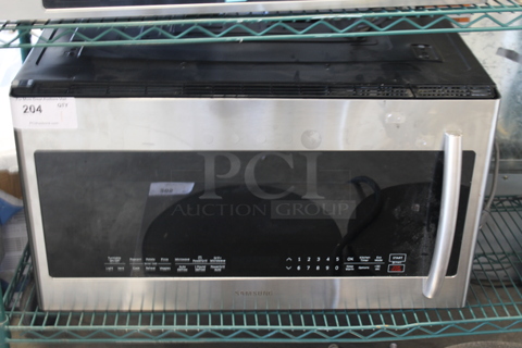 2016 Samsung ME21K7010DS Stainless Steel Microwave Oven. 120 Volts, 1 Phase.