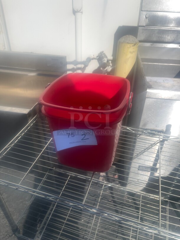 Red Bucket used for Washing Counters