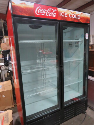 One Metalfrio 2 Door Glass Display Cooler With 6 Racks On Casters. WORKINH WHEN REMOVED. #NG49CHNC10. 54X29.5X82