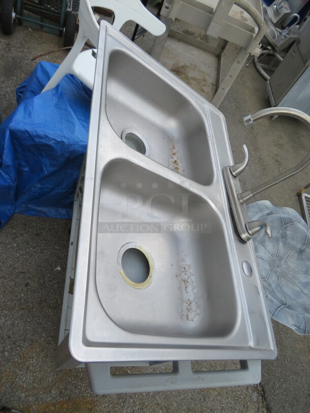 One Stainless Steel Sink With Faucet. 33X22X6
