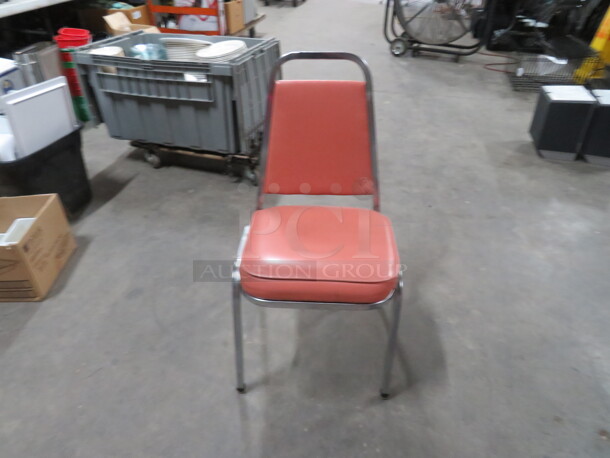 Chrome Stack Chair With Orange Cushioned Seat And Back. 5XBID