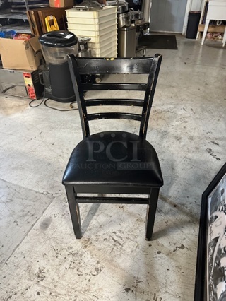 Black Wooden Chair With A Black Cushioned Seat. 2XBID