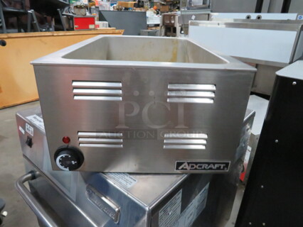 One Adcraft Food Warmer. 120 Volt. Model# FW-1200WF. 
