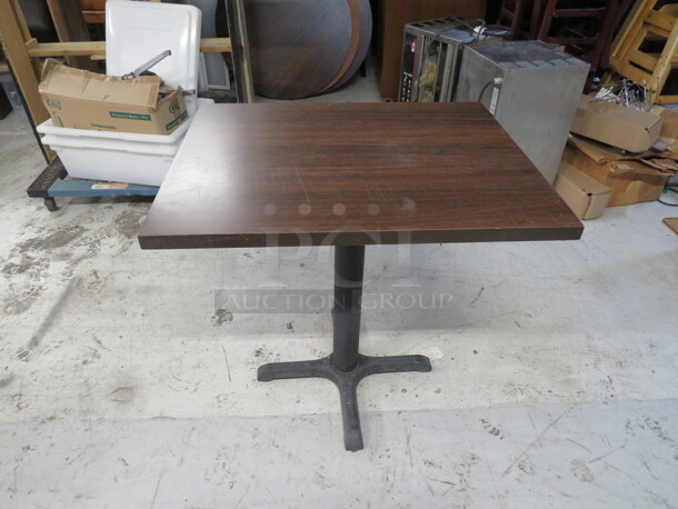 One Brown Laminate Table Top On A Pedestal Base. 24X30X29 - Image 1 of 1