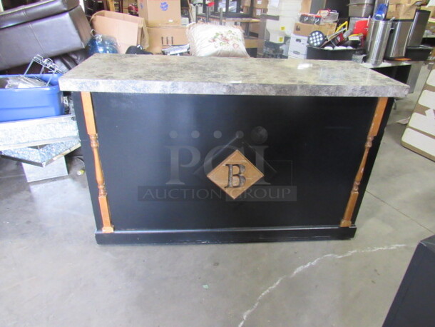 One Front Counter/Hostess Station With A Laminate Top, 4 Doors, And 2 Drawers, For Alot Of Storage. 67.5X26.5X41