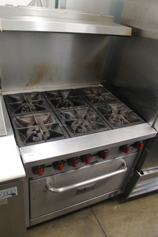 Entree R6-N-C Stainless Steel Commercial Natural Gas Powered 6 Burner Range w/ Oven, Over Shelf and Back Splash.