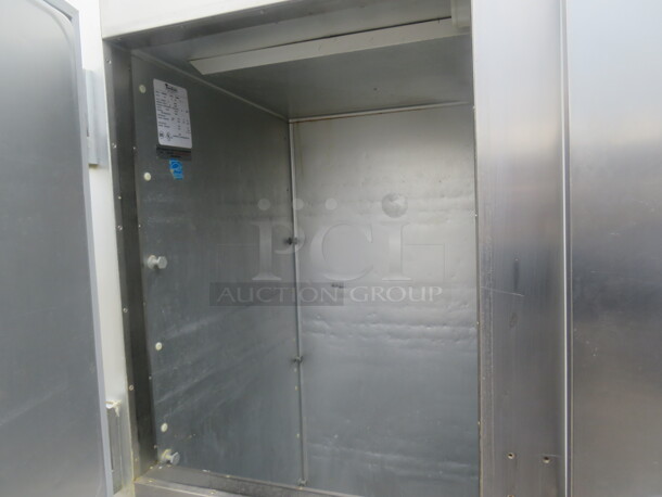 One Stainless Steel Traulsen 2 Section Half Door Refrigerator With 3 Racks On Casters. Model# G2000. 115 Volt. 52X35X83 - Image 3 of 3