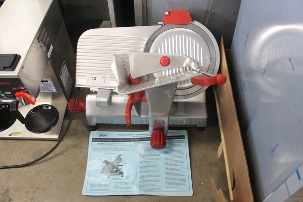 BRAND NEW SCRATCH AND DENT! 2022 Berkel B12-SLC Commercial Stainless Steel Electric Countertop Meat/Cheese Slicer On Rubber Feet. 115V, 1 Phase. Tested and Working!
