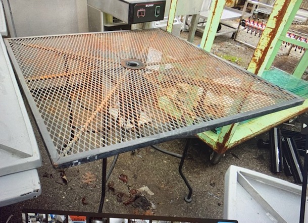 One Black Metal Patio Table With Umbrella Hole. 36X36X29. Assembly Required. - Image 1 of 1