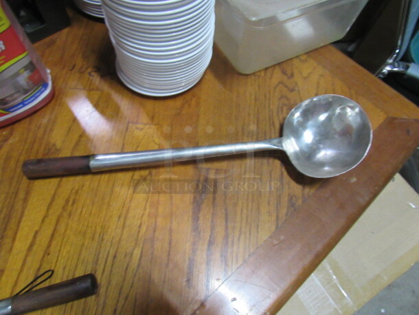 One Stainless Steel Long Handle Ladle. 