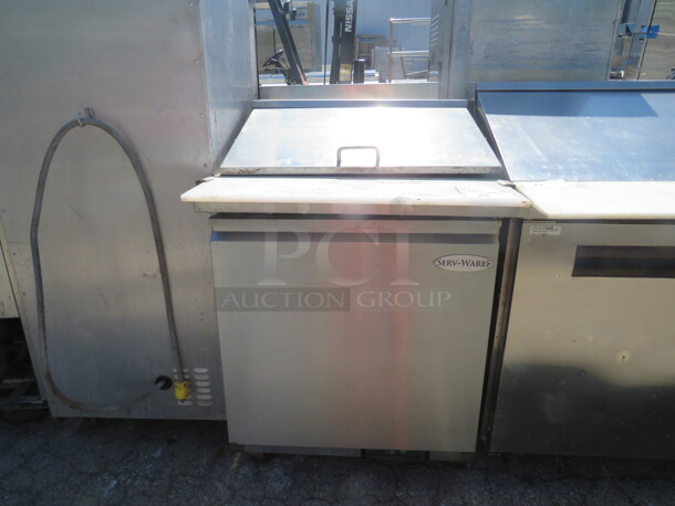 One Serveware 1 Door Refrigerated Prep Table With Cutting Board And 2 Racks, On Casters. Model# SP29-12M. 115 Volt. Working Not Cold. 29X36X45. - Image 1 of 2