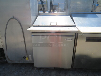 One Serveware 1 Door Refrigerated Prep Table With Cutting Board And 2 Racks, On Casters. Model# SP29-12M. 115 Volt. Working Not Cold. 29X36X45.