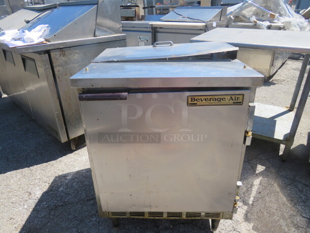 One Beverage Air 1 Door Refrigerated Prep Table With 1 Rack On Casters. Working NOT Cold. Missing Top Lid. Model# SP27. 115 Volt. 27X29X35 - Image 1 of 2