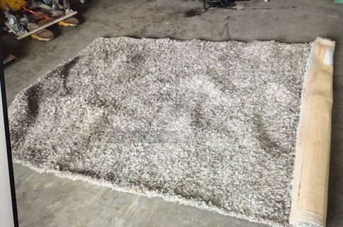 One 94X63 Shag Rug.