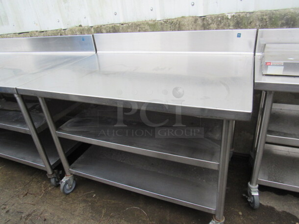 One Stainless Steel Table With 2 Stainless Under Shelves, On Casters. 48X32X40 - Image 1 of 2