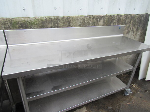 One Stainless Steel Table With 2 Stainless Under Shelves, On Casters. 60X20X40 - Image 2 of 2